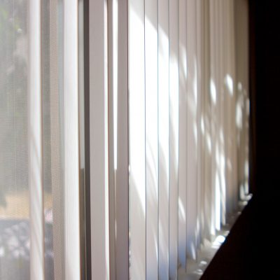 Blinds with light shining through